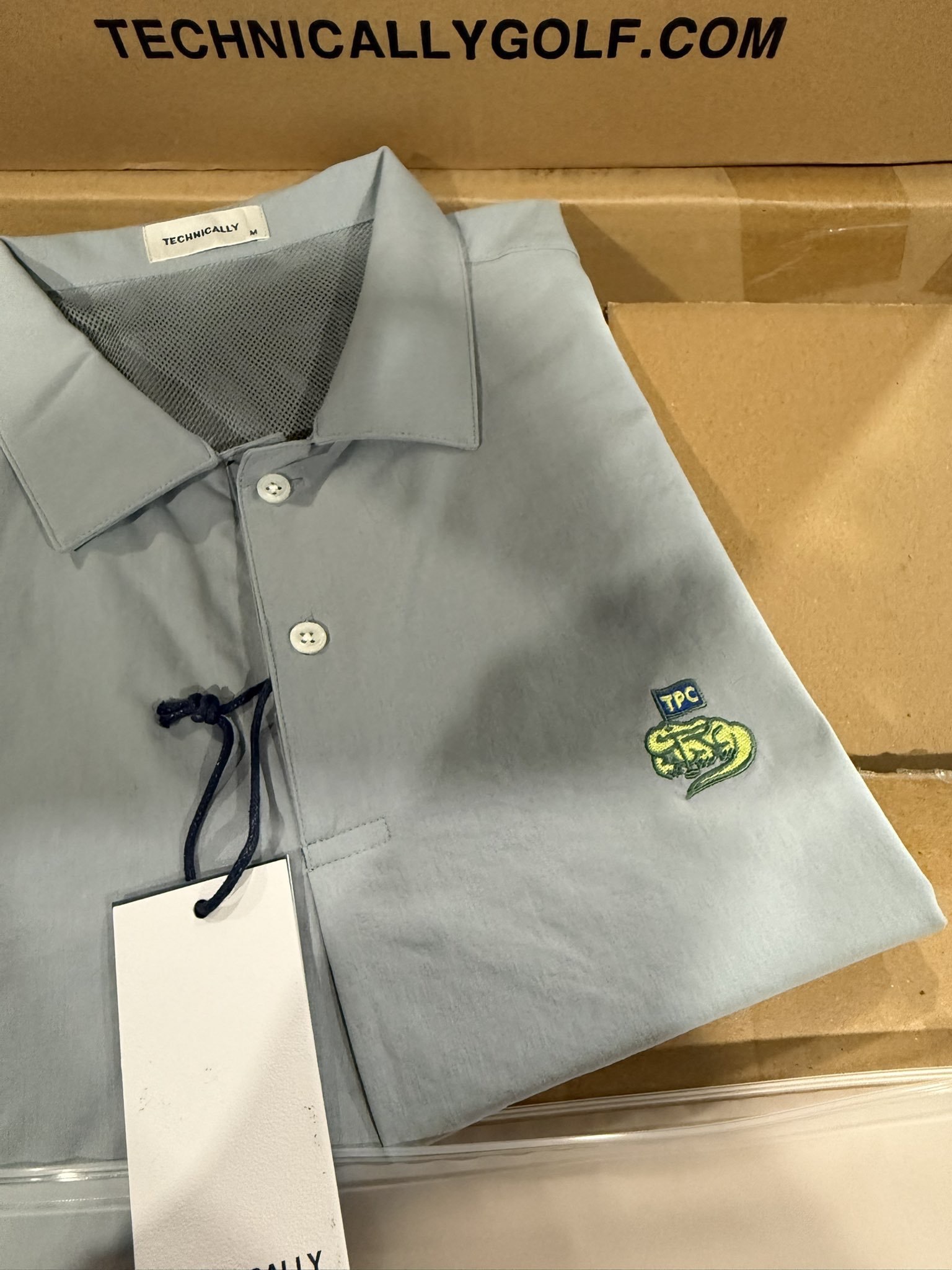 Technically Golf light blue TPC Sawgrass polo